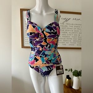 Sunseeker swimming suit. New with tags. Size 4